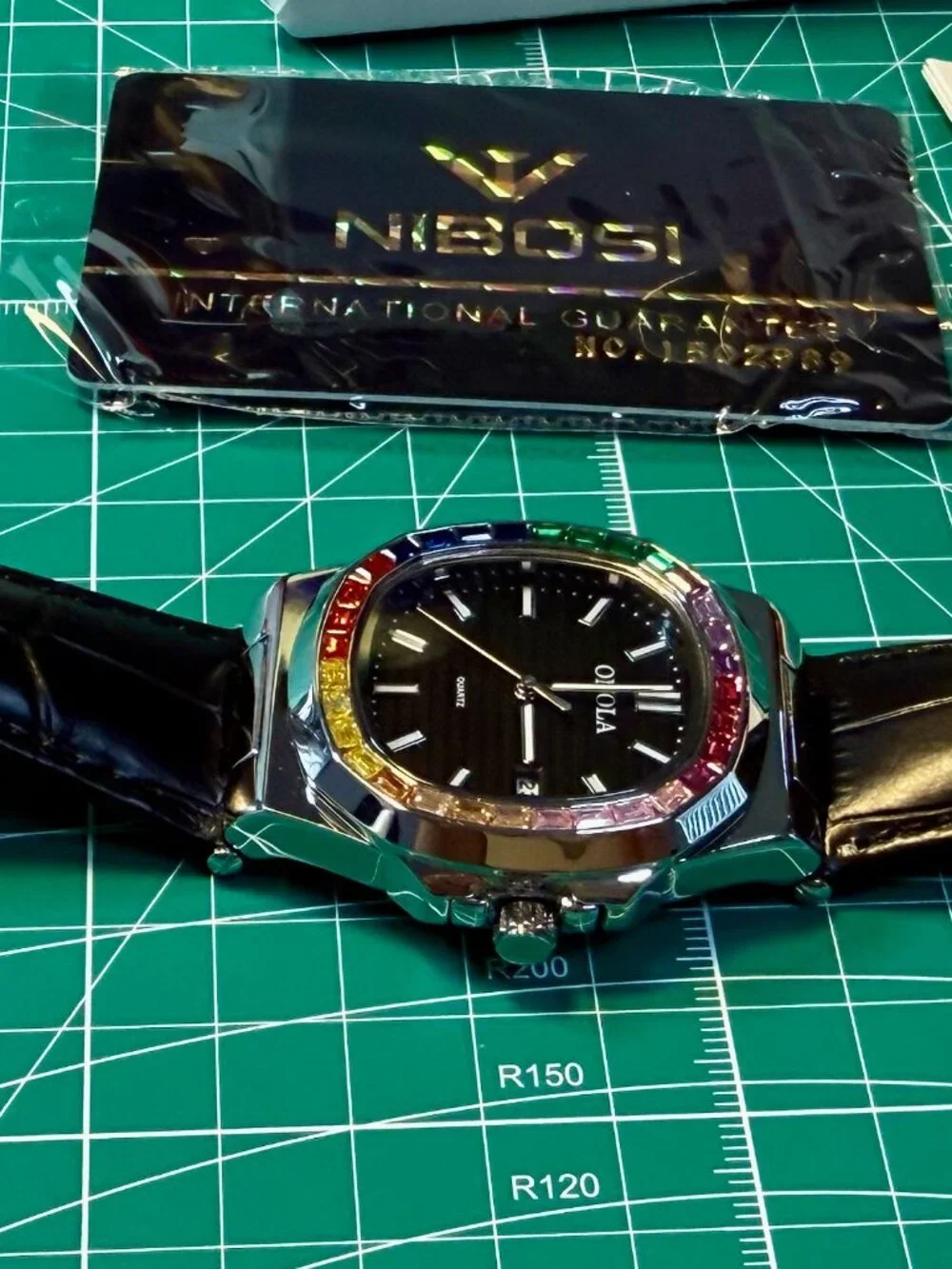 Onola quartz men's watch silver and black leather strap. Rainbow Gems Bezel.